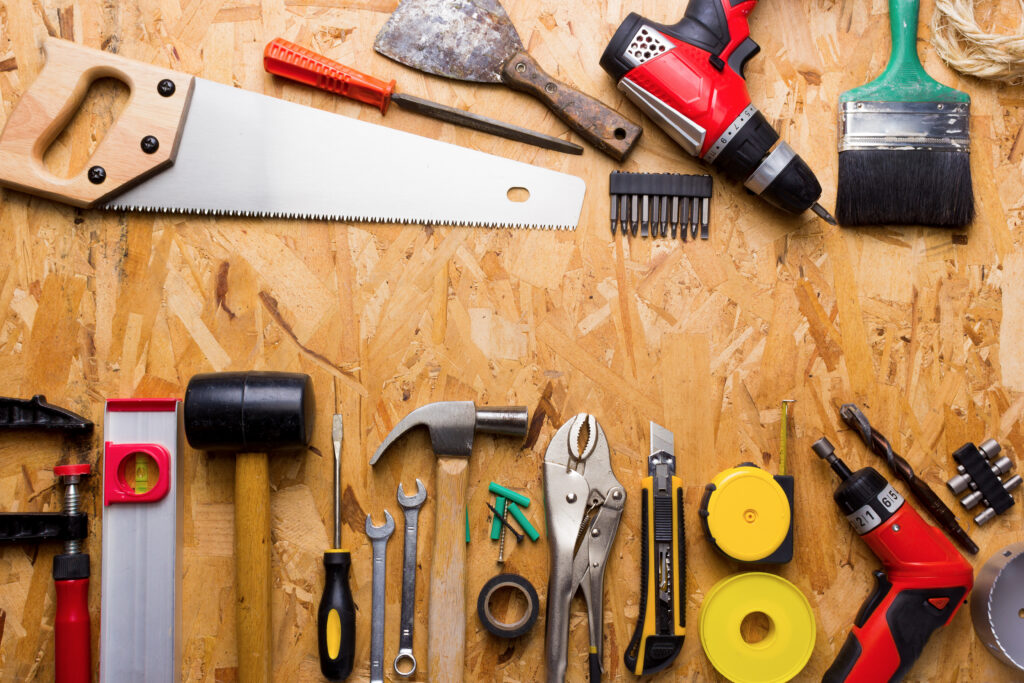 Tools on Wooden Background